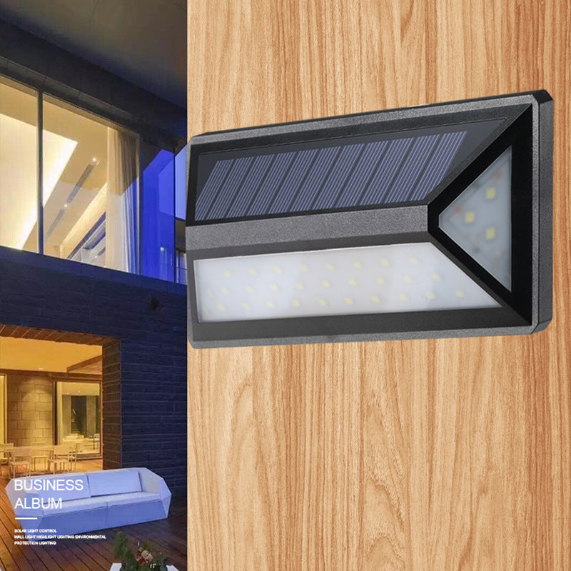 Solar wall light by My Store mounted on an exterior wall with a compact outdoor design
