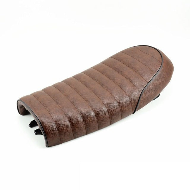 Retro modified CG125 motorcycle cafe seat with attached retro seat bag and buckle showing black upholstery