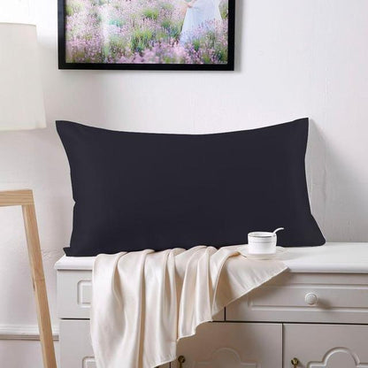 Double-sided 19 momme silk pillowcase in smooth fabric, shown in a neutral color beside its packaging