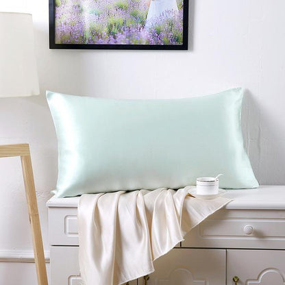 Double-sided 19 momme silk pillowcase in smooth, lustrous fabric, shown in a folded rectangular design