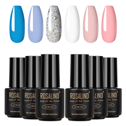 Six bottles of Fine nail polish in assorted colors displayed together