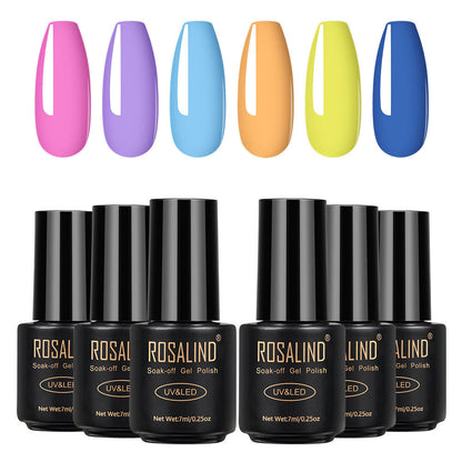 Six bottles of Fine nail polish in assorted shades displayed together
