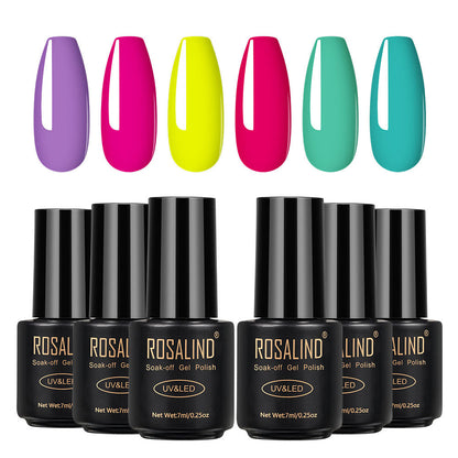 Six bottles of Fine nail polish in assorted colors displayed together