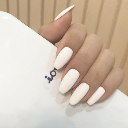 Frosted short ballet wear finished fake nails in solid color patch style, close-up product image