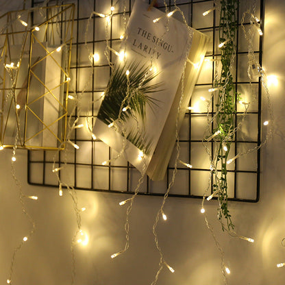 LED starry icicle light string with cascading white lights