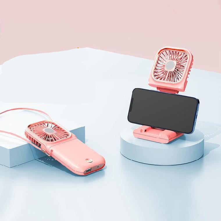 Cute portable mini fan for students and camping, compact handheld design in close-up view