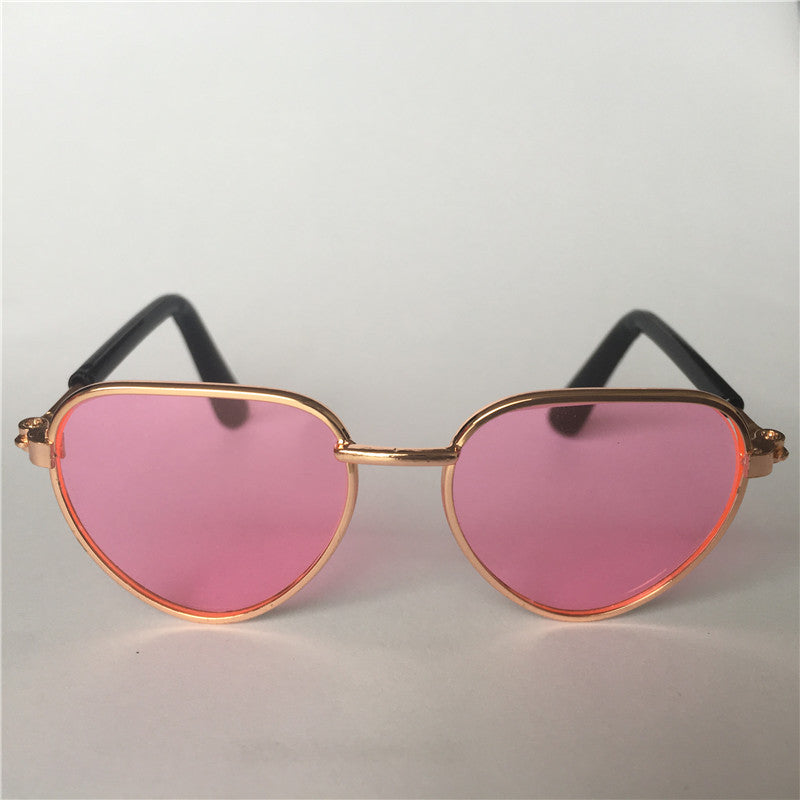 Creative fashion mini pet cat sunglasses in a playful design, front view