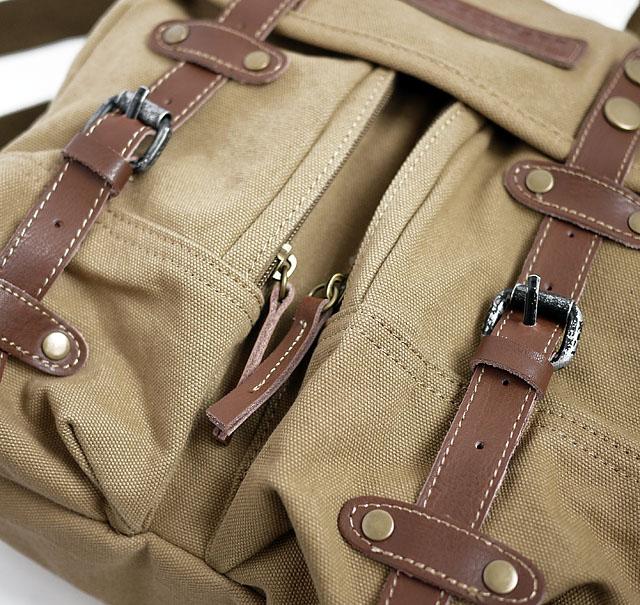 Casual canvas SLR camera bag with adjustable shoulder strap and protective padded compartments
