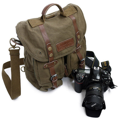 Casual canvas SLR camera bag with adjustable shoulder strap and durable exterior receptacle