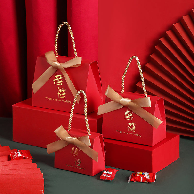 Portable Chinese style wedding candy gift box in red with traditional decorative details