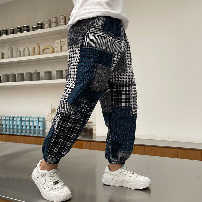 Boys’ summer casual sports pants in lightweight fabric, children’s pants laid flat for a clear view