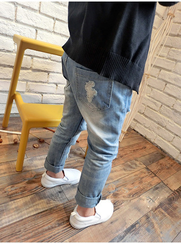 Korean style boys ripped trousers in a casual denim design with distressed details