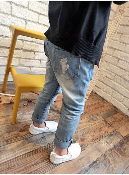 Korean style boys ripped trousers in a casual denim design with distressed details