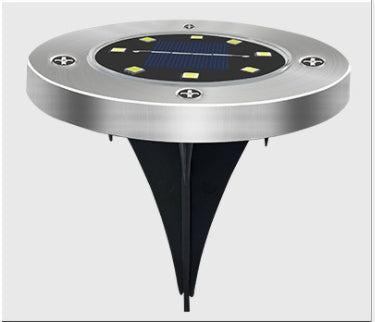 8LED waterproof solar powered garden lights illuminating an outdoor pathway at night