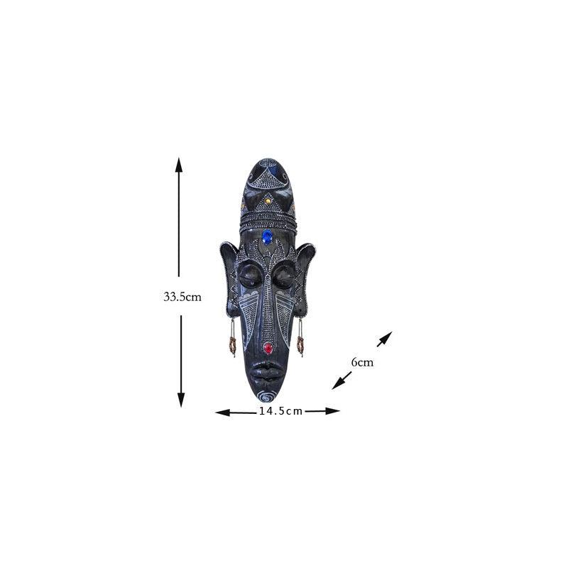 Resin tribal mask home decor sculpture with carved ethnic design and rustic finish