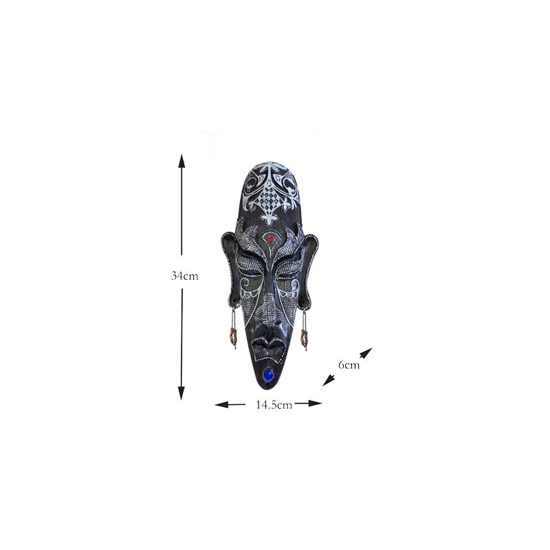 Resin tribal mask home decor with carved facial details in a rustic decorative finish