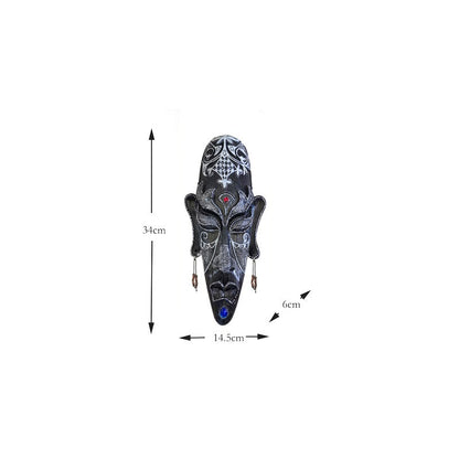Resin tribal mask home decor with carved facial details in a rustic decorative finish