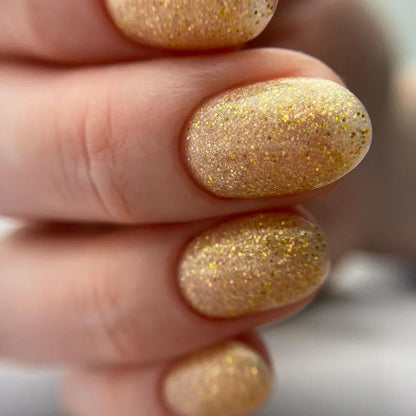 Luxio Sparkles Goddess 15ml nail polish bottle with shimmering, glittery gold finish and elegant packaging.