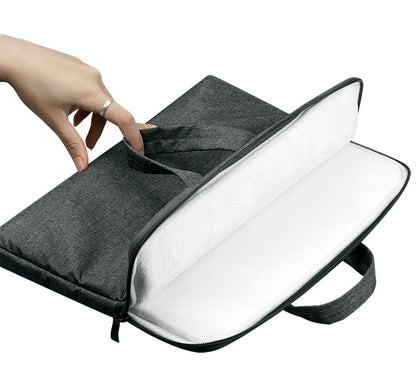 Black laptop bag compatible with Apple laptops, featuring a padded compartment and carry handles