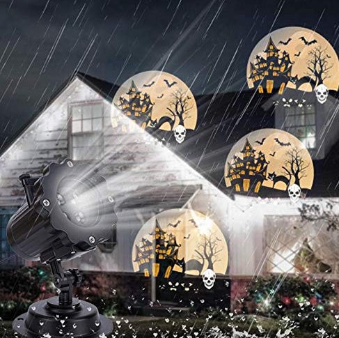Outdoor Christmas decoration LED laser projector light displaying festive patterns.