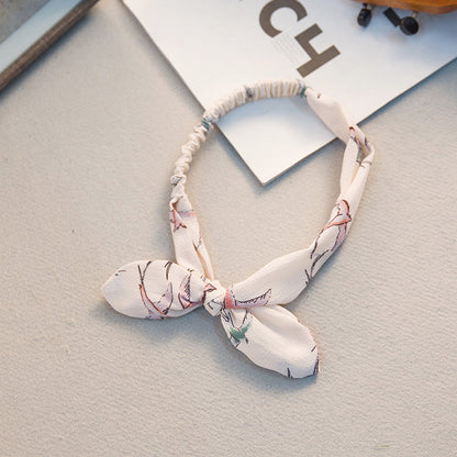 Big bow tie bunny ears headband with soft pink ears and oversized bow‑tie detail
