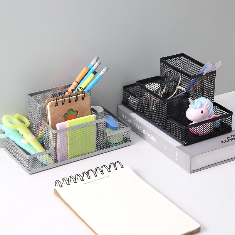 Creative metal four-grid pen holder for office use, featuring a modern design with multiple compartments for organization.