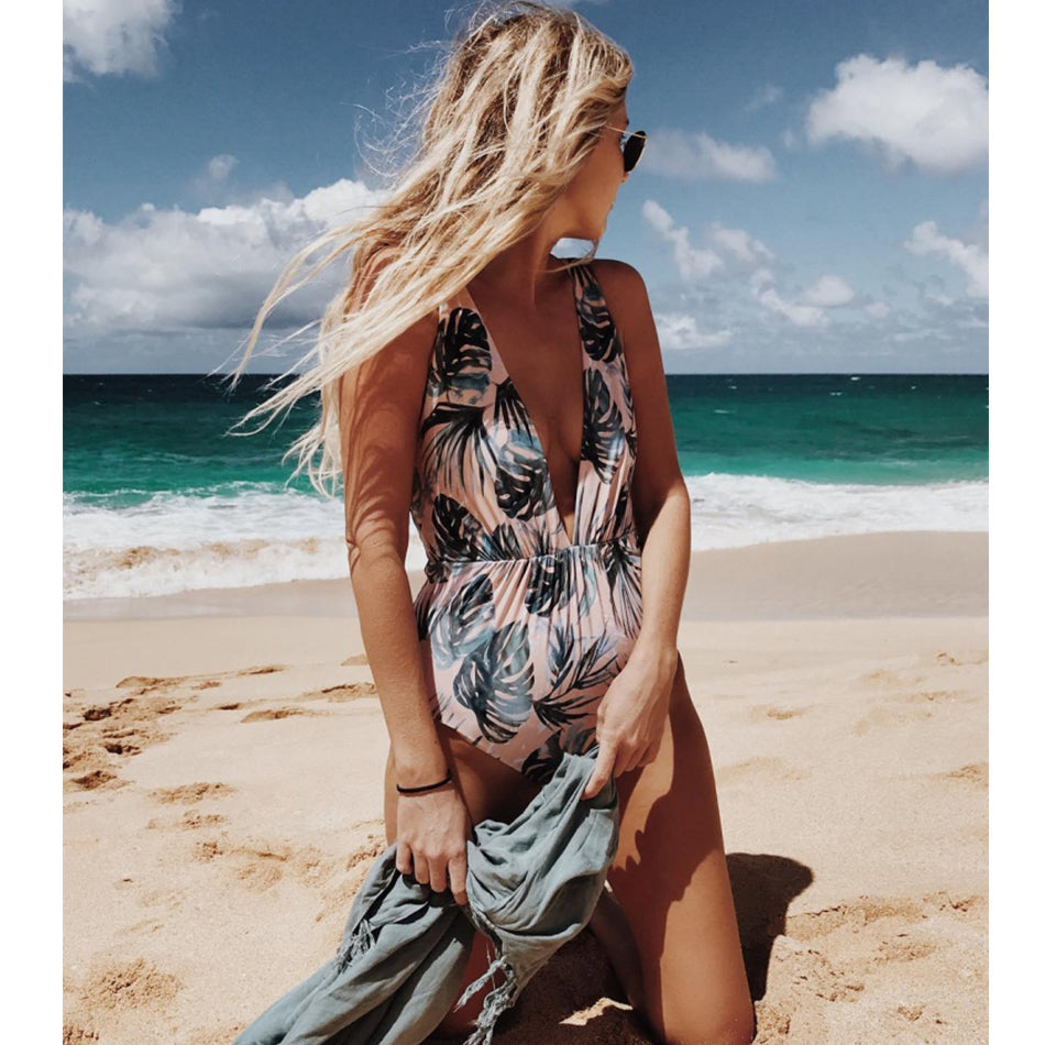 Black one-piece swimsuit with deep V neckline and sexy bikini-style design