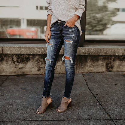 Ladies' chic denim trousers by BACKUPMYFILESNOW® featuring a stylish fit and classic blue denim fabric.