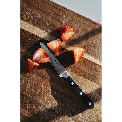 Dura Living Superior 4-piece black kitchen knife set with stainless steel blades and ergonomic handles displayed together.