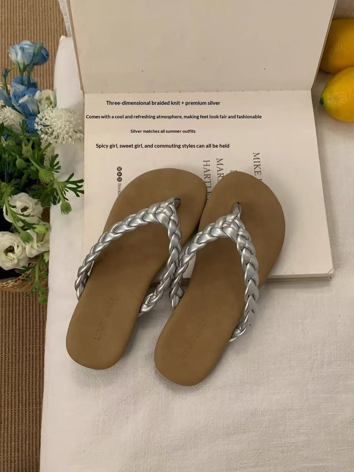 Retro flat minimalist woven flip-flops with woven straps and open-toe design, front view