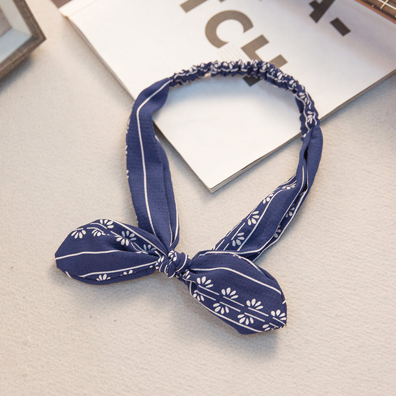 Big bow tie bunny ears headband with playful oversized bow and soft rabbit ear design