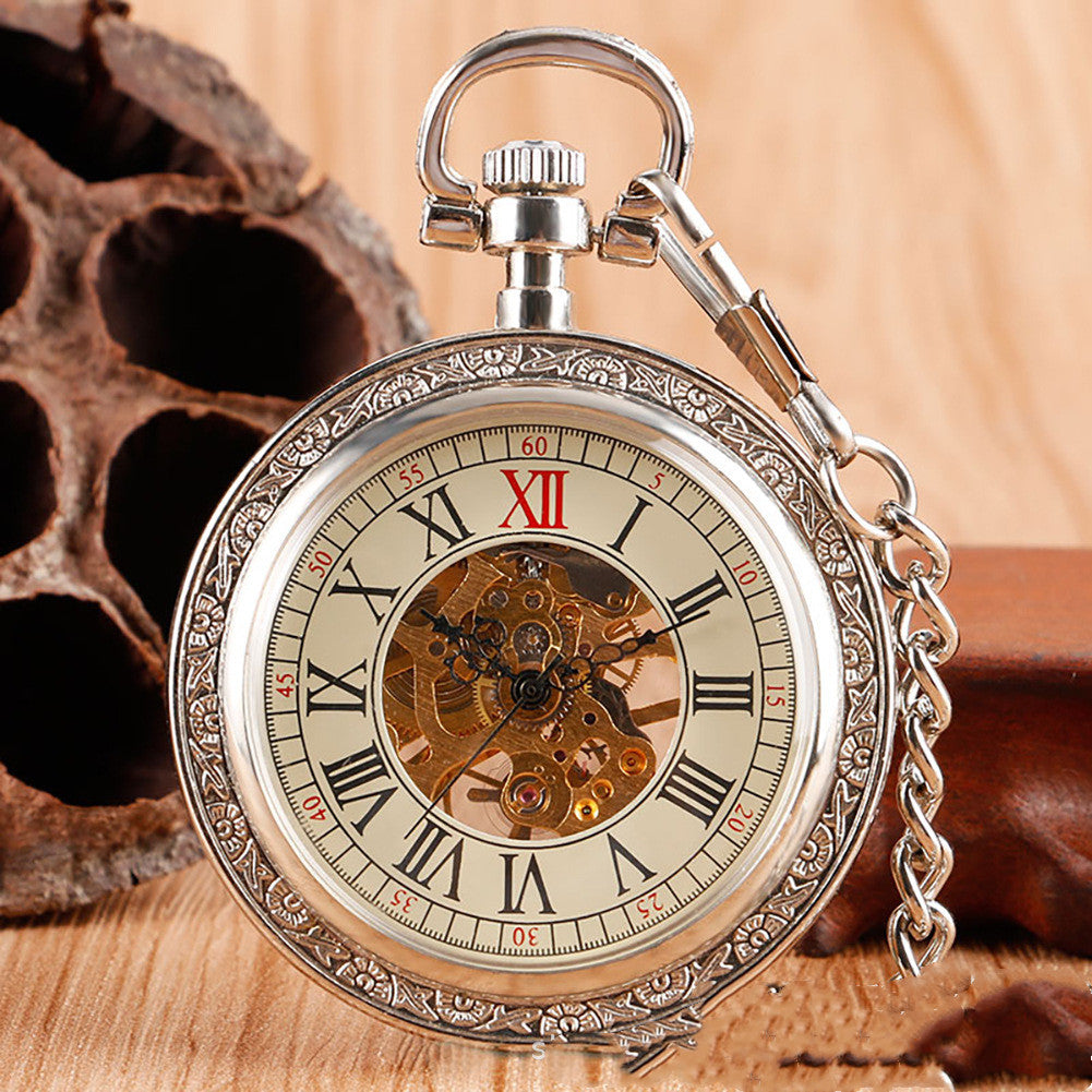 Carved mechanical pocket watch with intricate engraved design and visible classic watch face