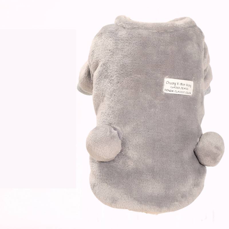 Small dog wearing an autumn and winter four-legged padded coat in a warm, protective design
