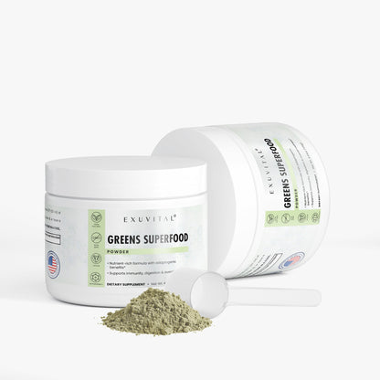 Container of Exuvital Greens Superfood powder with label showing vibrant green leaves and product details.