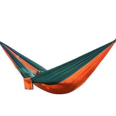 Portable nylon parachute backpacking hammock for outdoor use, shown in a compact double hammock design