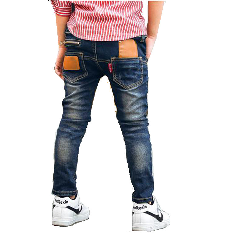 Boys stretch denim pants, front view in classic blue denim