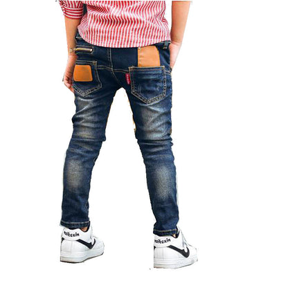 Boys stretch denim pants, front view in classic blue denim