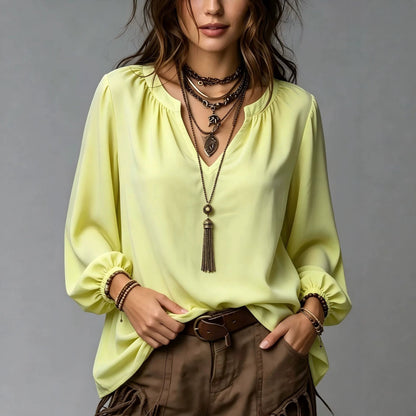 Elegant women's V-neck shirt with puff sleeves in a stylish design