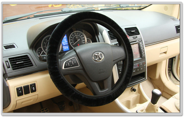 Black steering wheel cover for car interior, textured grip design