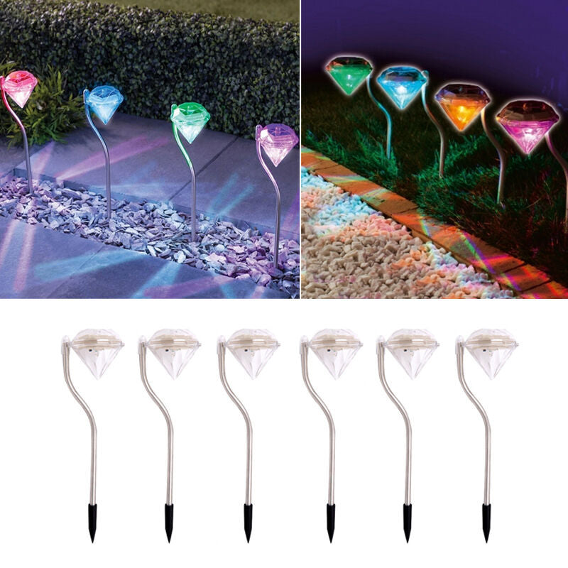 Solar powered garden diamond light with a faceted diamond-shaped design for outdoor illumination