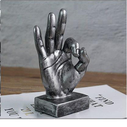 Resin gesture ornaments in assorted hand gesture designs
