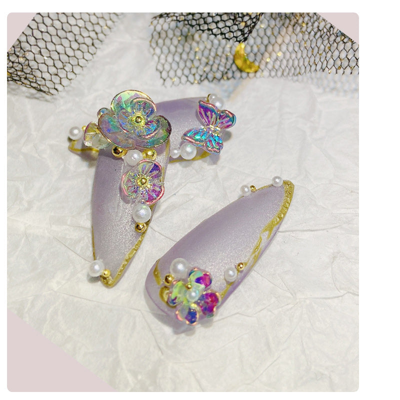 Flower butterfly nail design close-up in pink and white floral pattern