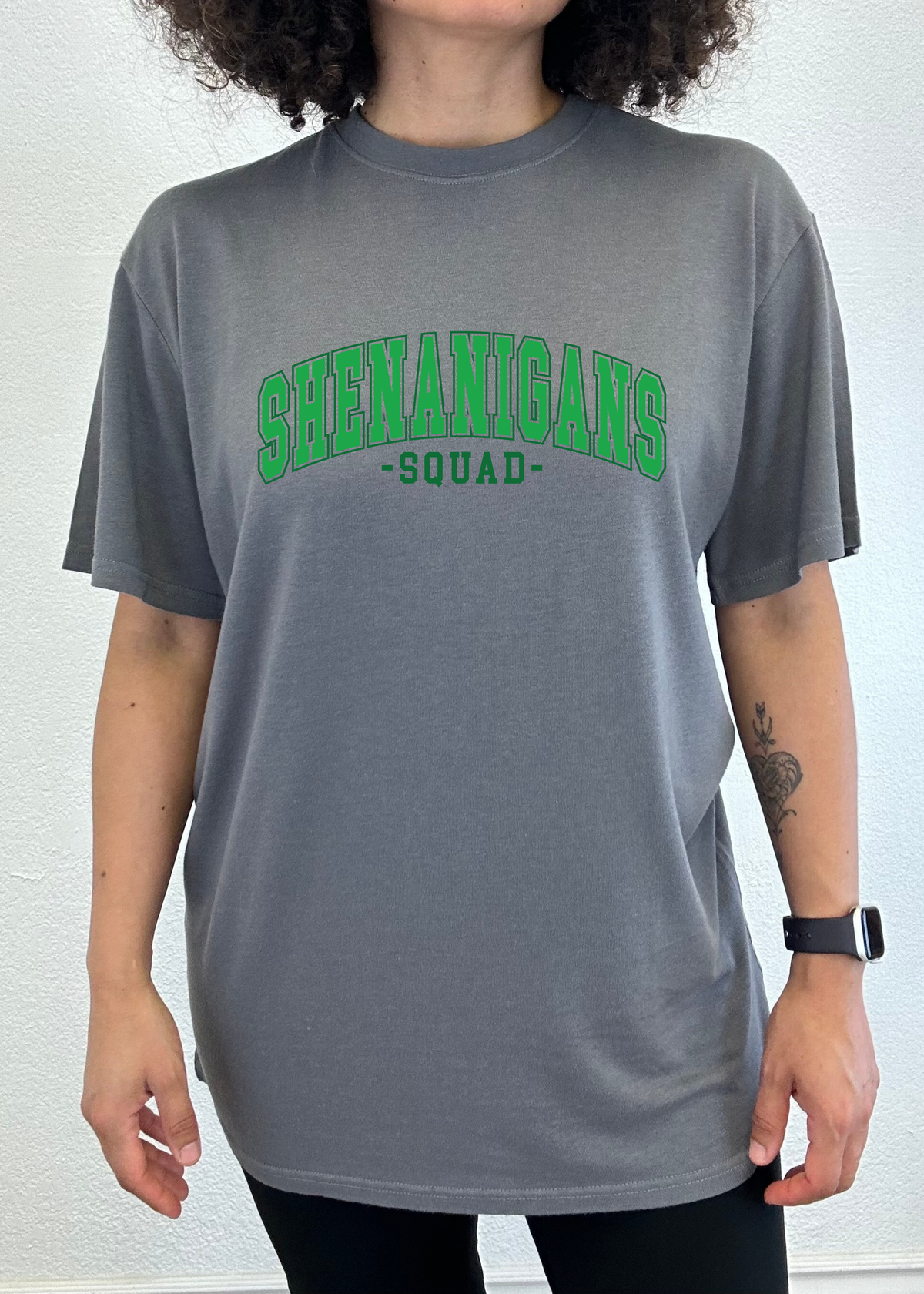 Unisex bamboo and cotton graphic T-shirt by Spun Bamboo featuring a colorful "Shenanigans Squad" print on the front.