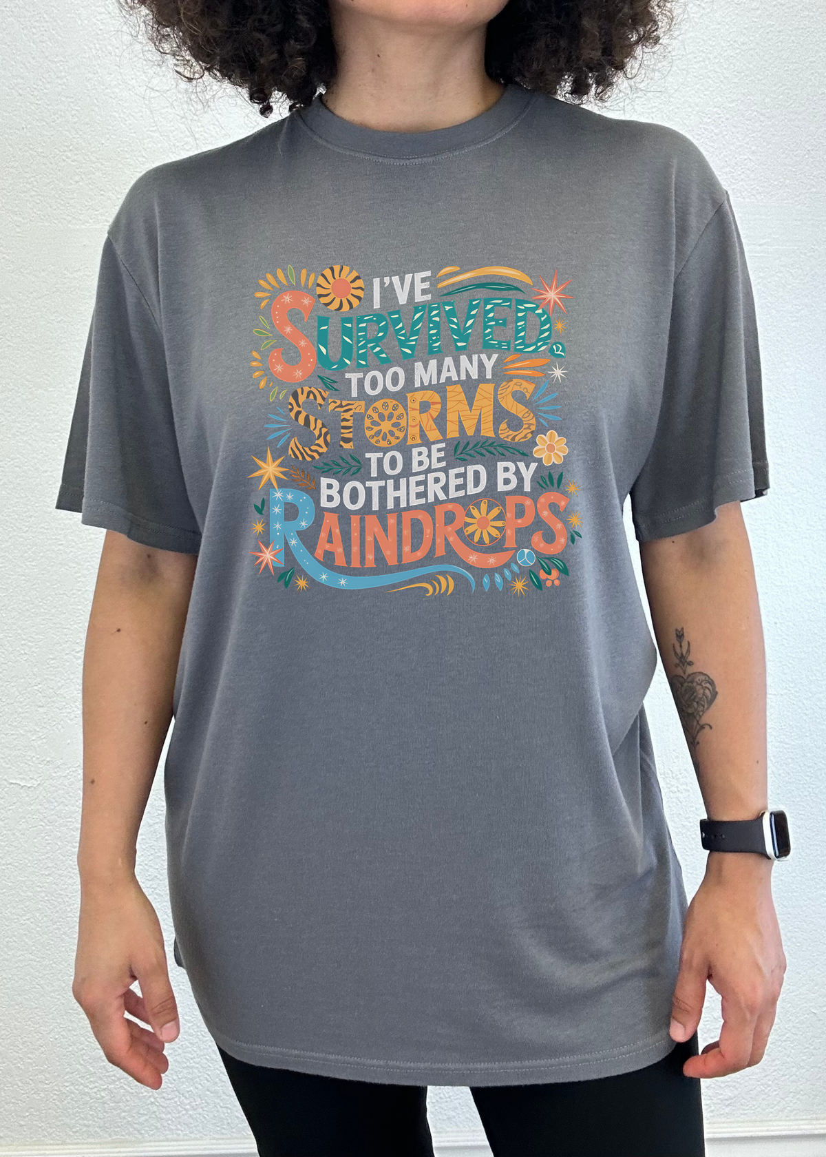 Unisex Spun Bamboo graphic t-shirt with storm-themed print, made from bamboo and cotton, featuring bold weather survival message.