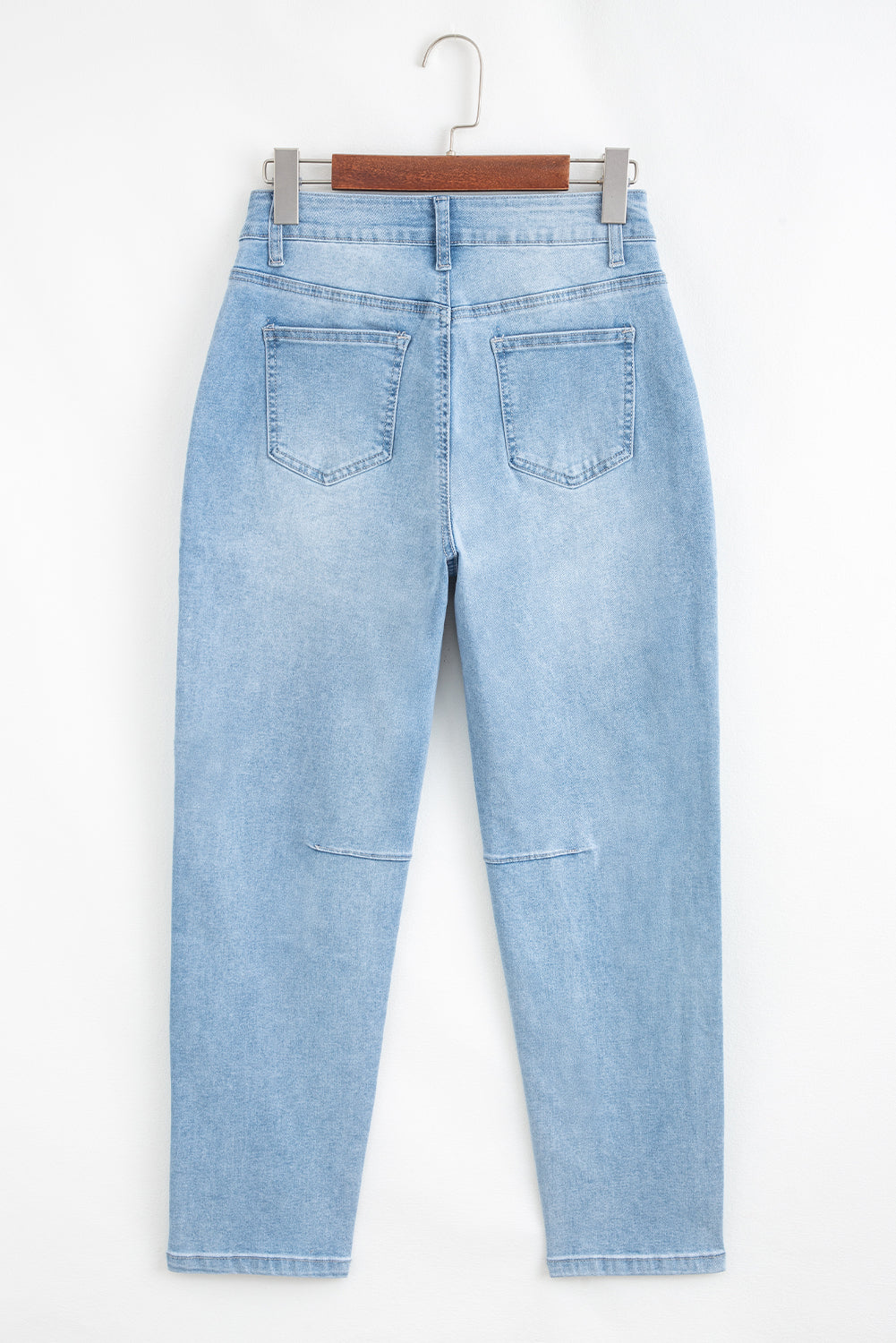 Light blue Lacey Relaxed Patch Jeans by Threaded Pear with distressed details and relaxed fit, casual denim style.