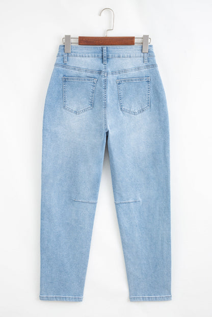 Light blue Lacey Relaxed Patch Jeans by Threaded Pear with distressed details and relaxed fit, casual denim style.