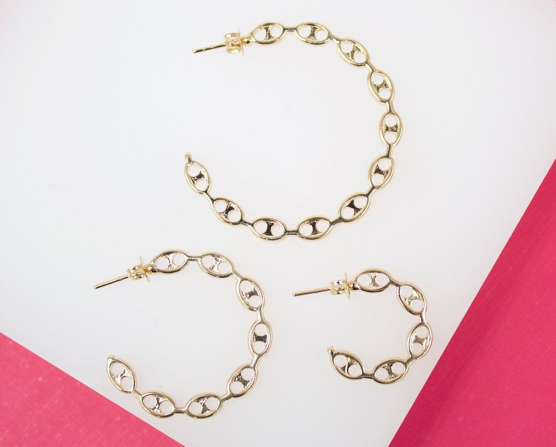 MIA Jewelry 18K gold filled mariner style open hoop earrings, showing shiny gold hoops with a smooth open design.