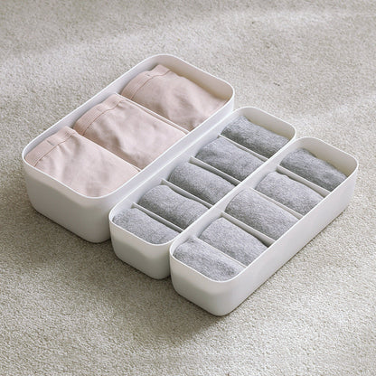 Plastic underwear organizer storage box for socks, bras, and undergarments in a desktop drawer or closet