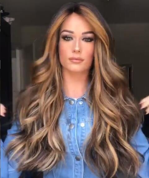 Medium long curly hair wig with voluminous curls, shown in a natural style