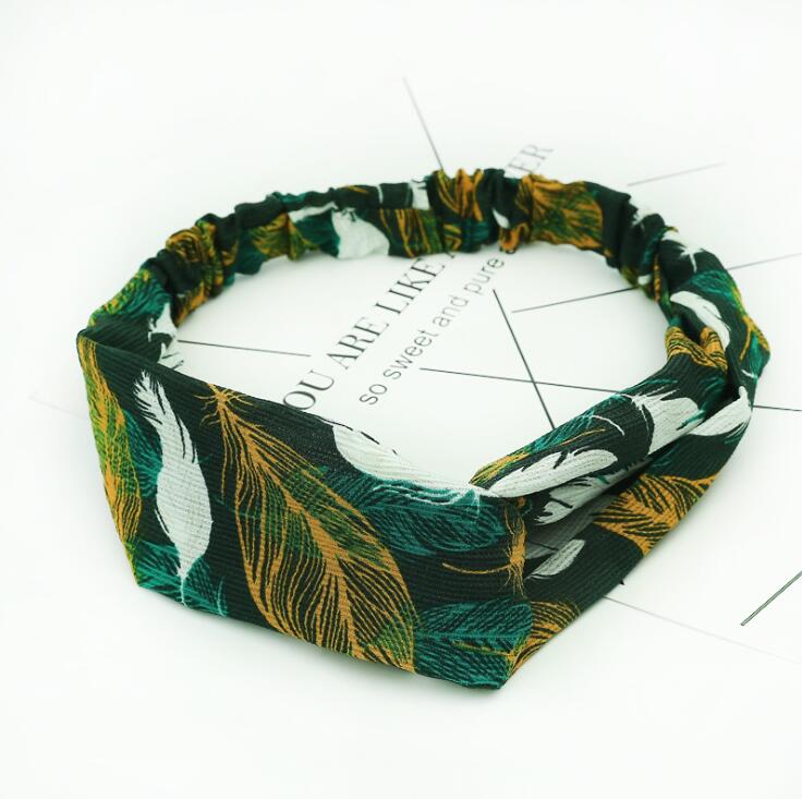 Women's retro style printed headband with colorful pattern on white background